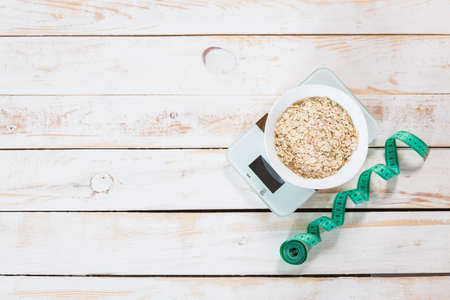Bowl of porridge on wooden tableの写真素材