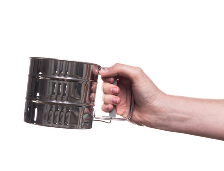 kitchen utensils in the hand of women isolated on white backgroundの写真素材