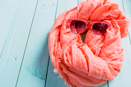 Summer holiday setting with scarf and sunglassesの写真素材