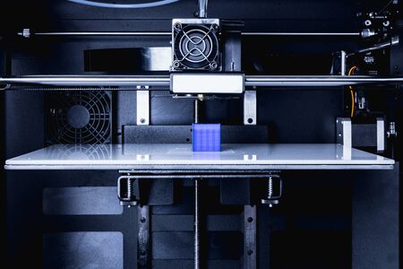 head of 3d printer in actionの写真素材