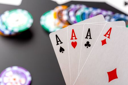 poker chips and cards on black backgroundの写真素材