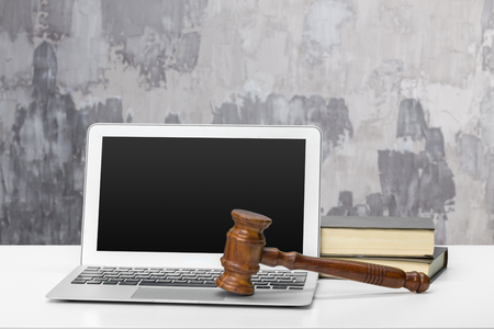 Laptop And Mallet On Tableの写真素材
