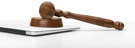 Laptop And Mallet On Tableの写真素材