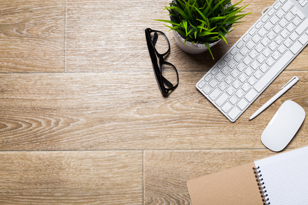 Working place on wooden tableの写真素材