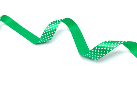 a green ribbon isolated on white backgroundの写真素材