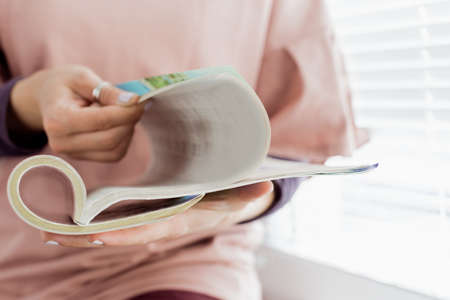 woman reading a magazineの写真素材