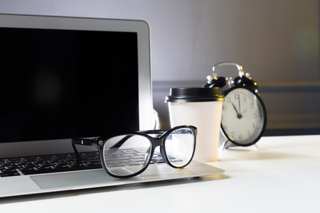 Office leather desk table with computer, suppliesの写真素材
