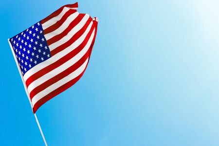 American flag against blue sky