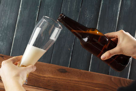 Glass of beer and beer bottleの写真素材