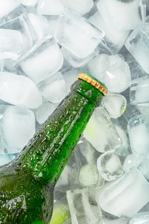 Bottles of cold and fresh beer with iceの写真素材