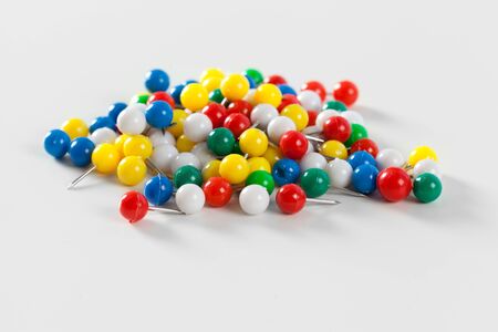 colorful color push pins isolated on white background