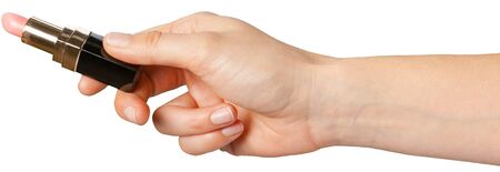 lipstick in hand isolated on white .の写真素材