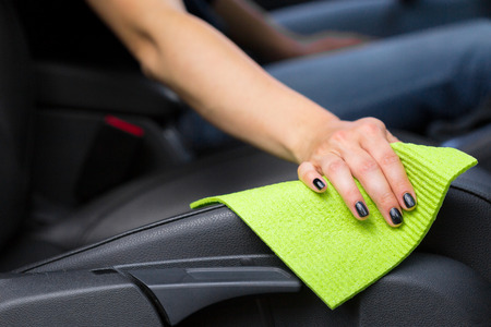 Hand with microfiber cloth cleaning carの写真素材