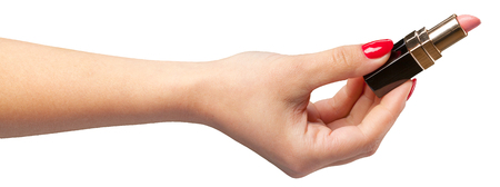 lipstick in hand isolated on white .の写真素材