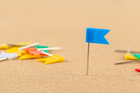 Group of thumbtacks pinned on corkboardの写真素材