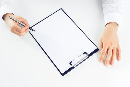 Clipboard on a white table. close upの写真素材