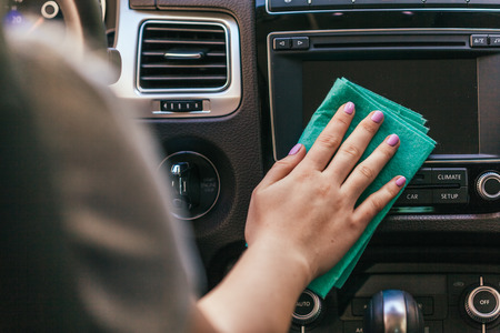 Hand with microfiber cloth cleaning carの写真素材