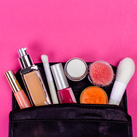 Set of colorful cosmetics on pink tableの写真素材