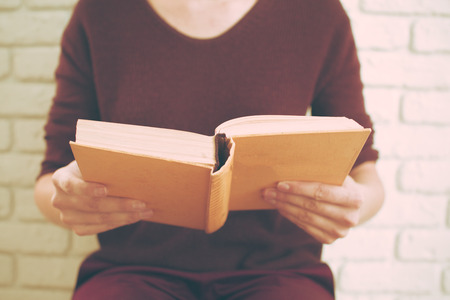 Woman reading the bookの写真素材