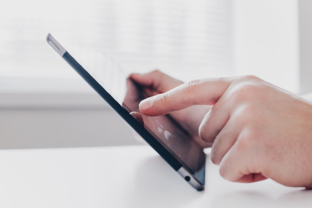 Young businessman working with modern devices