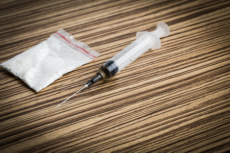 Drug syringe and cooked heroinの写真素材