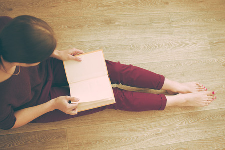 Woman reading the bookの写真素材