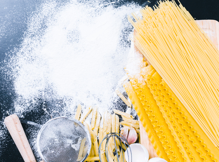 dry pasta spaghetti with ingredientの写真素材