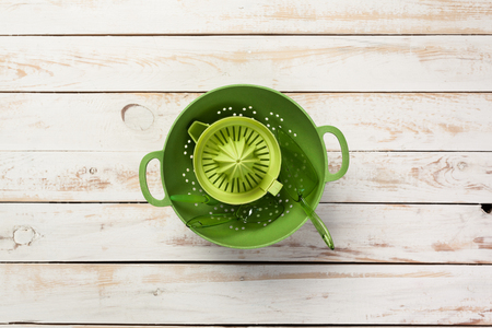 Various kitchen utensils on wooden tableの写真素材