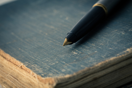 Vintage books and penの写真素材