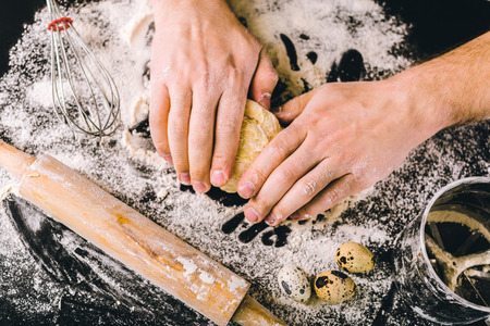 Hands kneading a dough