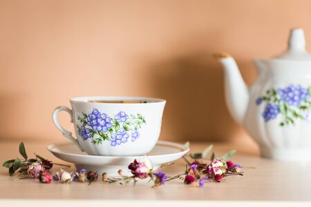 Cup of tea with teapot in vintage styleの写真素材