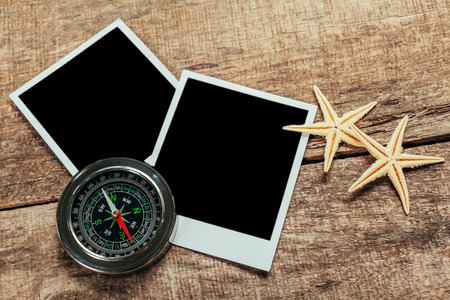 Nautical background with retro sunglasses and empty polaroid photos frames, sea shellsの写真素材