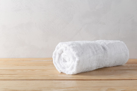 spa towels on wooden surfaceの写真素材
