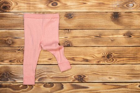 Baby stuff on wooden tableの写真素材