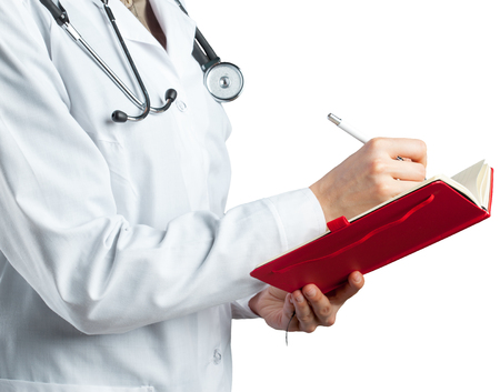 Woman doctor with a stethoscope. Isolated on white.の写真素材
