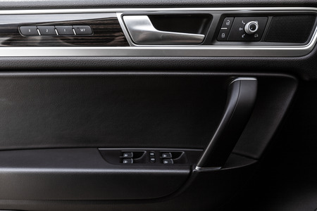Inner door handle, modern car interior detail