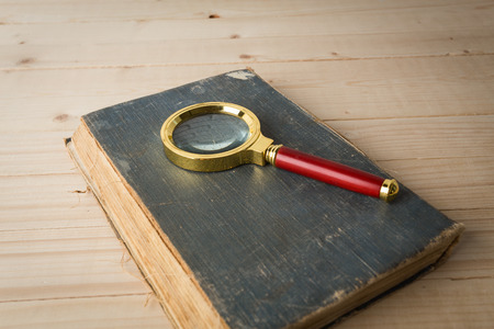 Magnifying glass and bookの写真素材