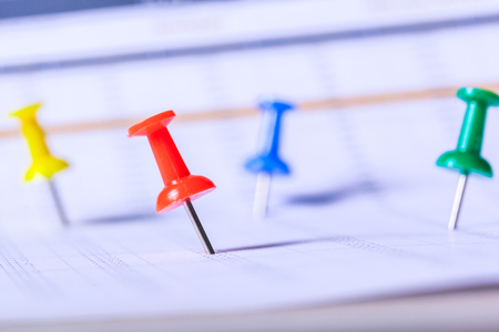 Concept image of a calendar with red push pinの写真素材
