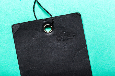 Tag and string on blue backgroundの写真素材