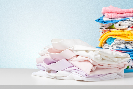 Stack of bath towels on light white background closeupの写真素材