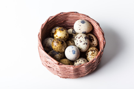 Fresh quail eggs at wooden plate closeupの写真素材