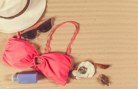 Holiday accessories on sand beachの写真素材