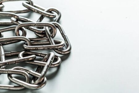 close up of metal chain part on white background