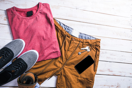 cool fashion casual men outfit on wooden table