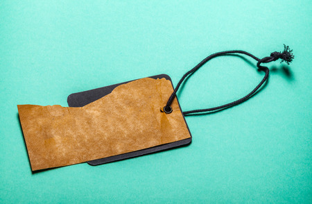 Tag and string on blue backgroundの写真素材