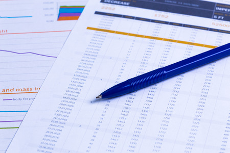 Business performance graph with ballpoint penの写真素材