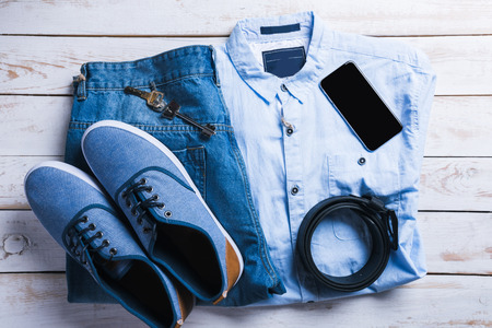 cool fashion casual men outfit on wooden table