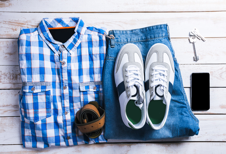 cool fashion casual men outfit on wooden tableの写真素材