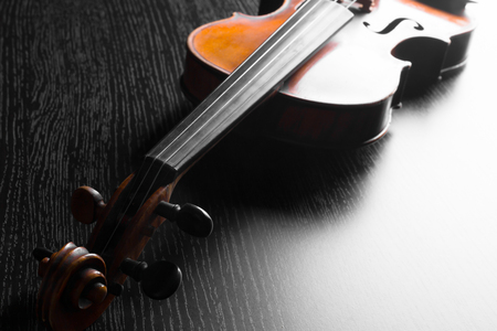 Old violin on a black backgroundの写真素材