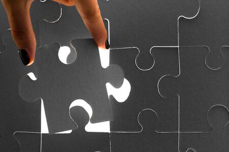 Hands holding puzzle pieces, business concept backgroundの写真素材